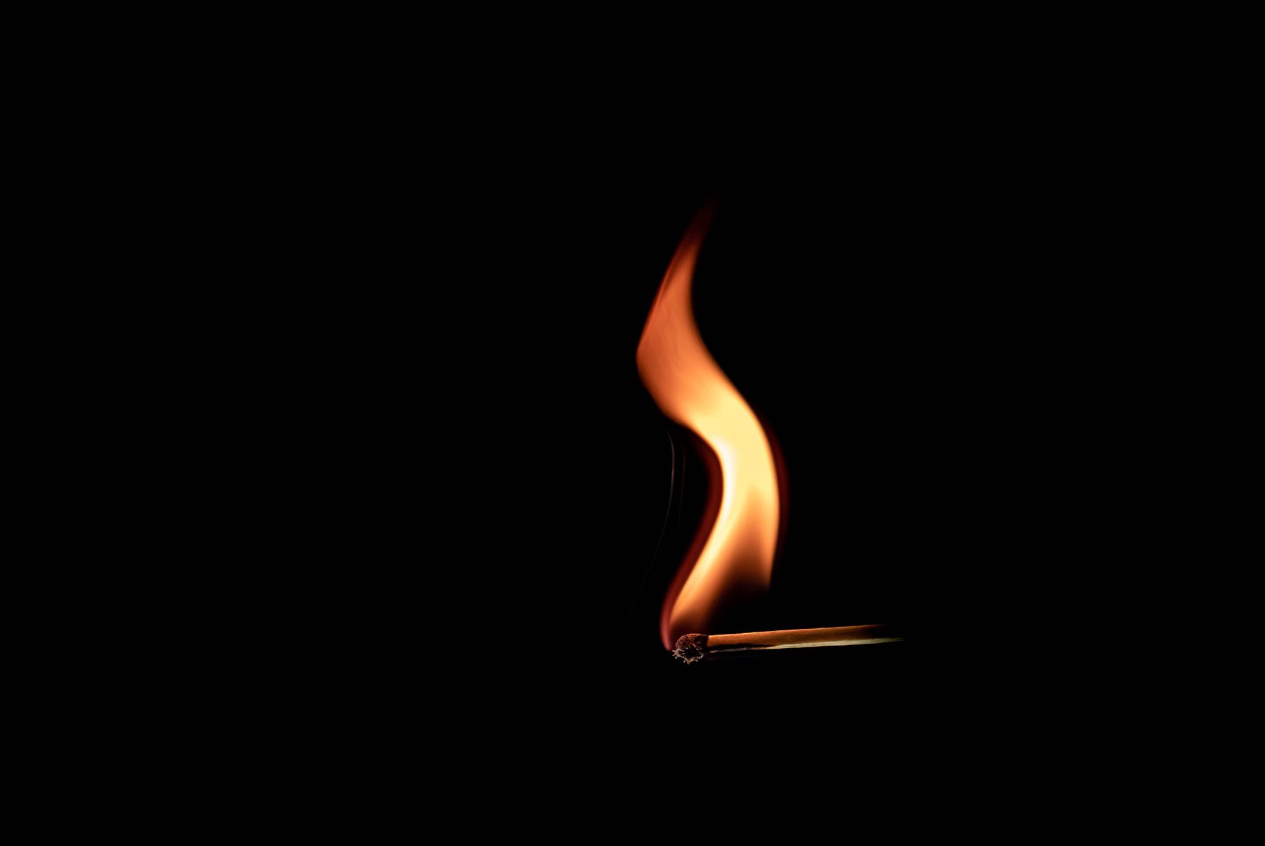 Match Stick Burning Isolated on Black Background